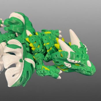1 Layer At A time Monstera Dragon, articulated fantasy dragon with green, white, and yellow gradient PLA filament, 19 inches long.