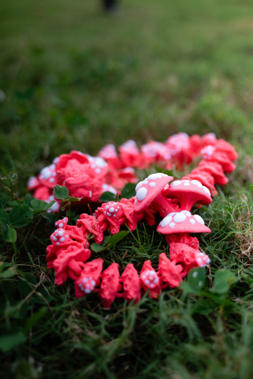 Pink decorative mushrooms on grass