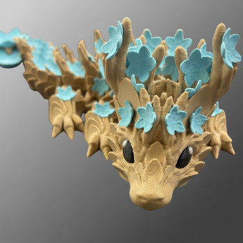 1 Layer At A time Baby Cherry Blossom Dragon figurine with light brown wood-like texture and light blue flowers.
