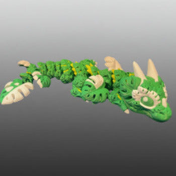 1 Layer At A time Baby Monstera Plant Dragon, a green and white articulated dragon with monstera leaf details.