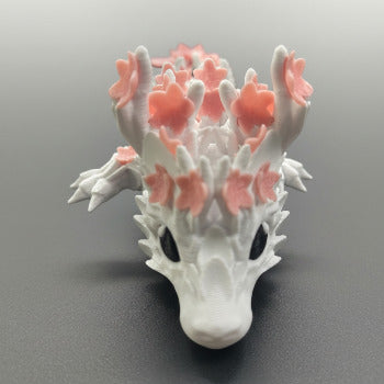 1 Layer At A time Baby Cherry Blossom Dragon figurine with white pearlescent scales and pink sakura-inspired wings.