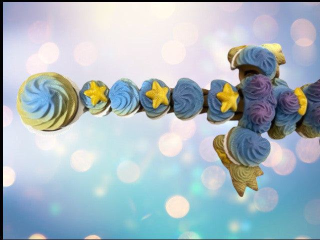 1 Layer At A time blue and yellow cupcake dragon with yellow stars and articulated body, 11.5 inches