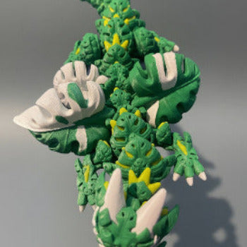 1 Layer At A time Monstera Dragon, articulated fantasy creature with green, yellow, and white leaf-shaped details, 19 inches long.