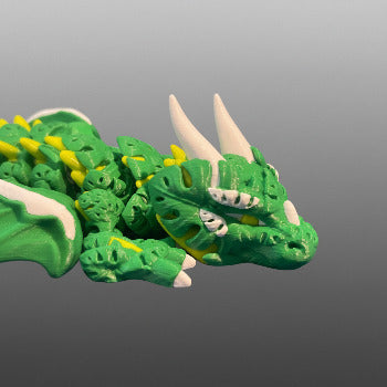 1 Layer At A time Monstera Dragon articulated toy in green, yellow, and white PLA plastic. Features leaf details and smooth movement.