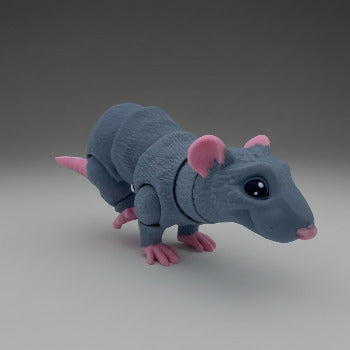 Toy rat on a city street with buildings and people in the background